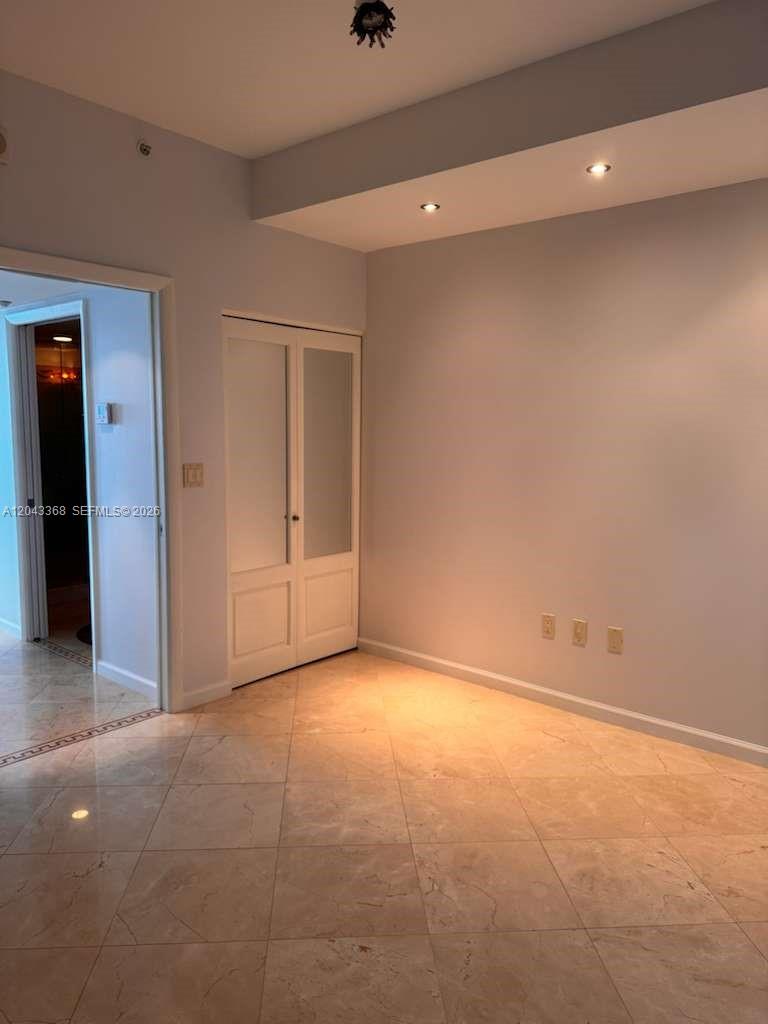 A room with light-colored walls, tile flooring, a white closet, and recessed ceiling lighting — 5025 Collins Ave # 1602, Miami Beach FL 33140, MIAMI BEACH, FL