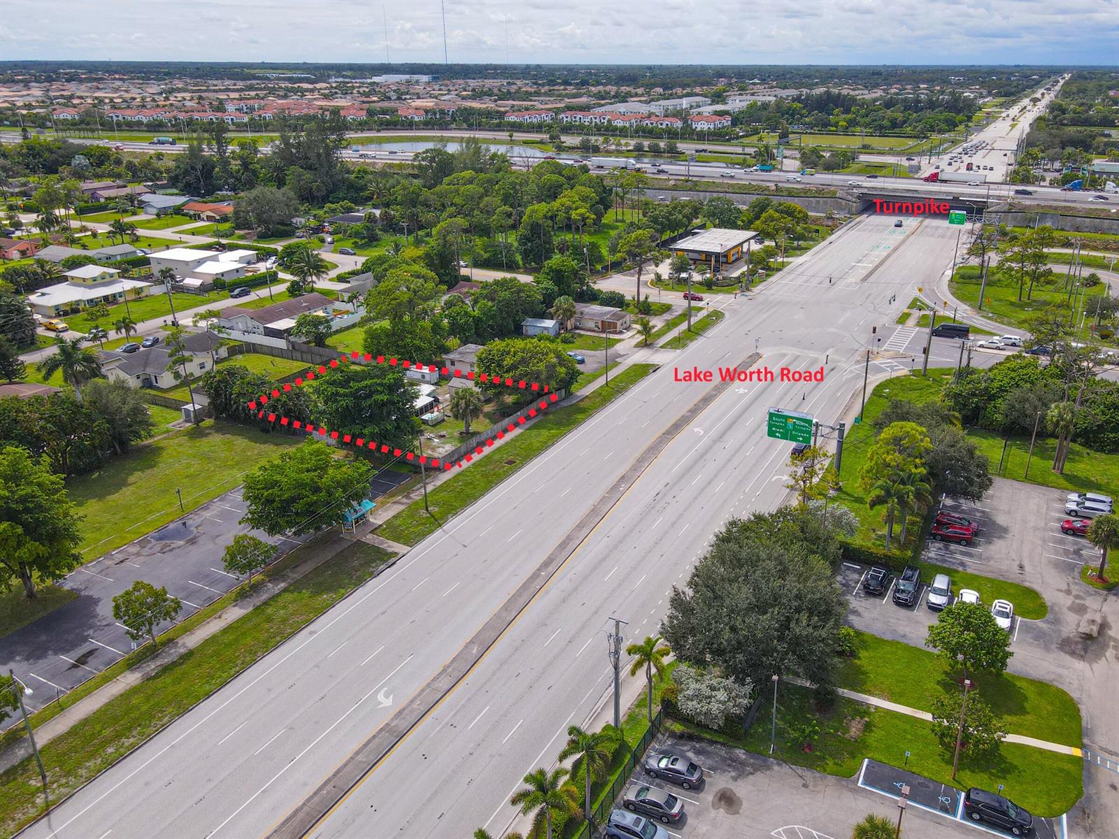 An aerial view shows a residential lot outlined in red adjacent to a major road — 122 Springdale Road, FL 33467, FL