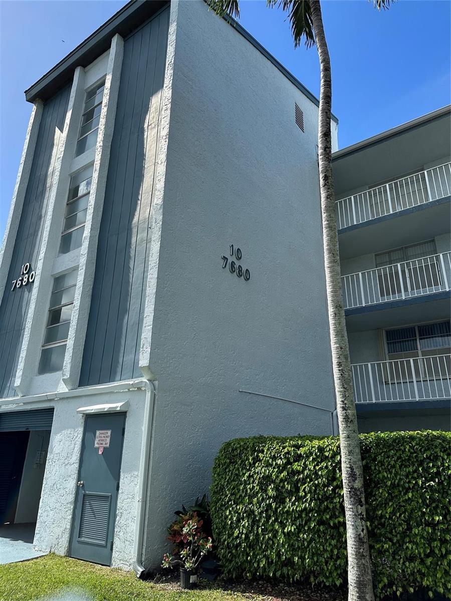 A tiled entryway features a white door with frosted glass and a louvered closet door — 7680 NW 18th Street # 406, Margate FL 33063, MARGATE, FL