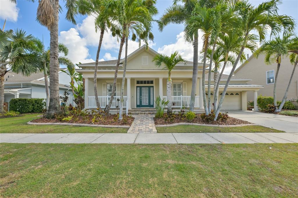 A one-story house with a front porch, palm trees, and a paved walkway — 5229 BRIGHTON SHORE DRIVE, APOLLO BEACH, FL