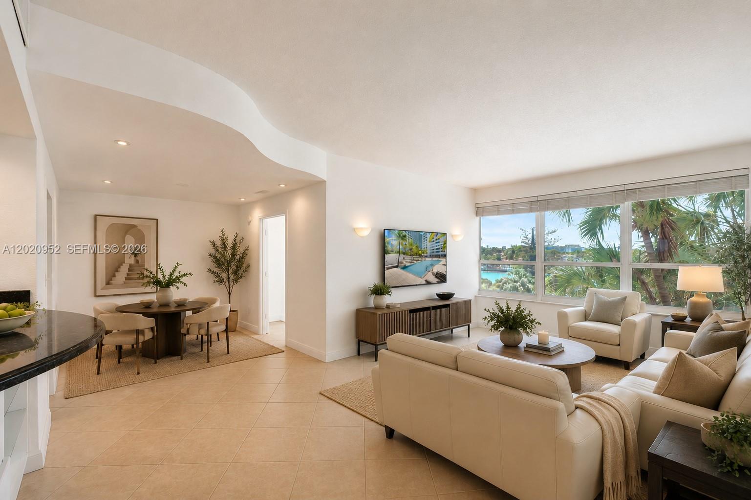 A bright living and dining area features tile floors, neutral furniture, and large windows — 4925 Collins Ave # 3H, Miami Beach FL 33140, MIAMI BEACH, FL