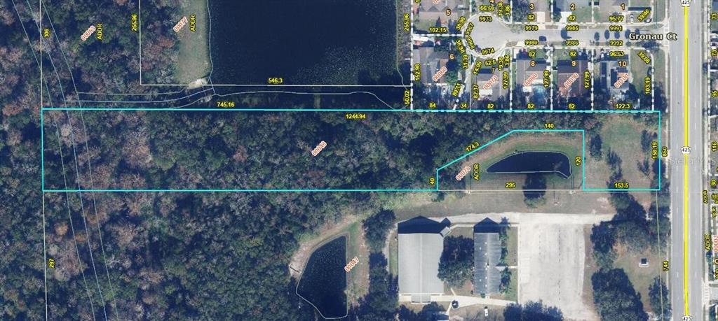 This is an aerial map showing a rectangular parcel of land with a small pond — 850 N DEAN ROAD, ORLANDO, FL
