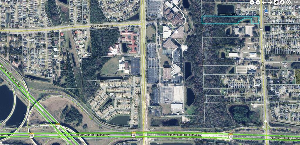 This aerial map shows a rectangular property highlighted in blue near a major highway intersection — 850 N DEAN ROAD, ORLANDO, FL