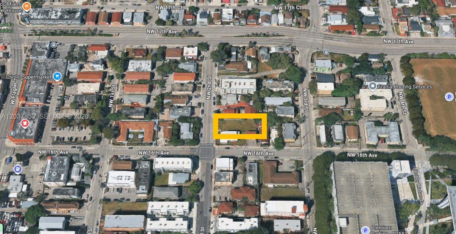 An aerial view of a rectangular vacant lot highlighted in yellow within a city neighborhood — 1611 NW 2nd St, Miami FL 33125, MIAMI, FL