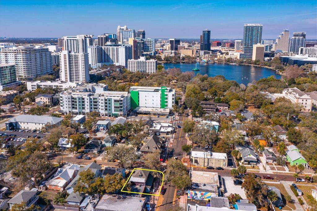 An aerial view shows a residential property outlined in yellow within a dense urban neighborhood — 37 HILL, ORLANDO, FL
