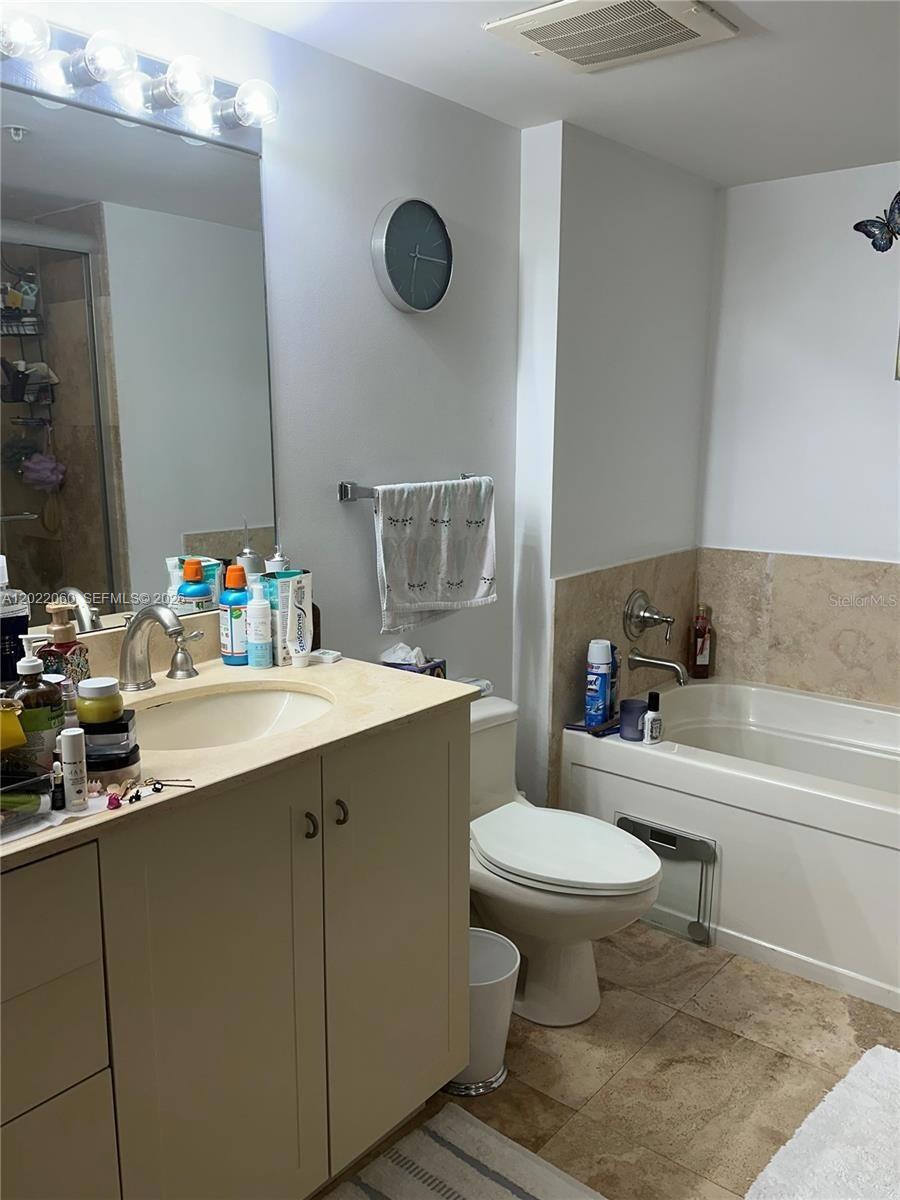 A bathroom features a vanity with a sink, a toilet, and a shower-tub combination — 3232 SW 22nd Ter # 1607, Miami FL 33145, MIAMI, FL