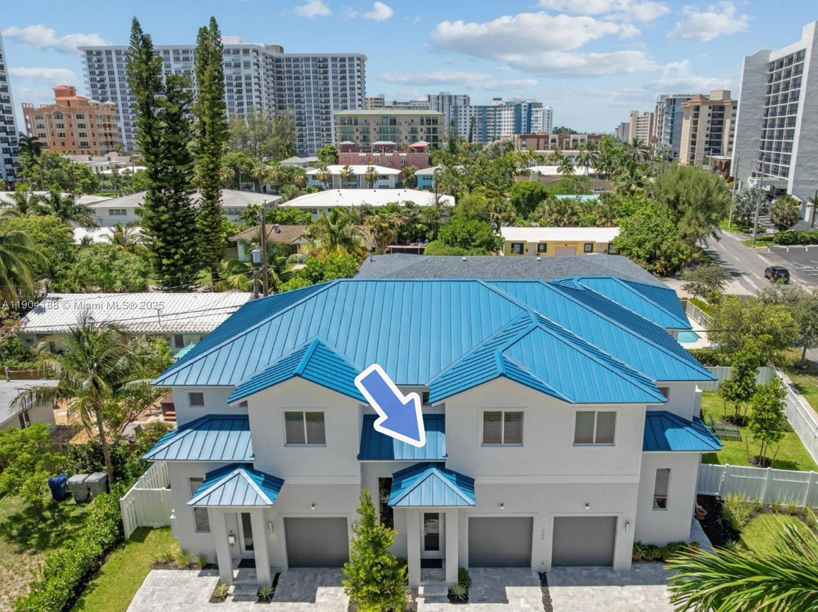 An aerial view of a multi-unit residential building with a blue metal roof — 554 N Riverside Dr # B, Pompano Beach FL 33062, POMPANO BEACH, FL