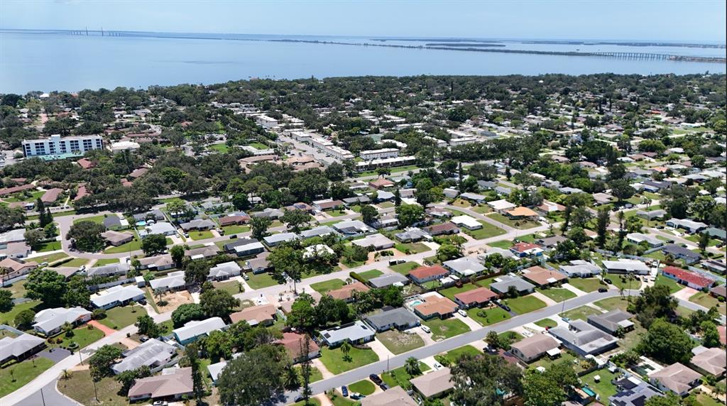 An aerial view of a residential neighborhood near a large body of water — 1050 62ND AVE SOUTH UNIT E-4, ST PETERSBURG, FL