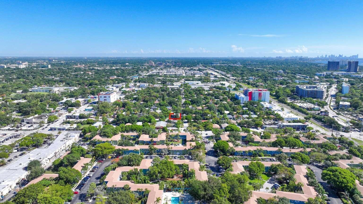An aerial view shows a residential neighborhood with a red-outlined lot in the center — 295 NE 55th Street, Miami FL 33137, MIAMI, FL