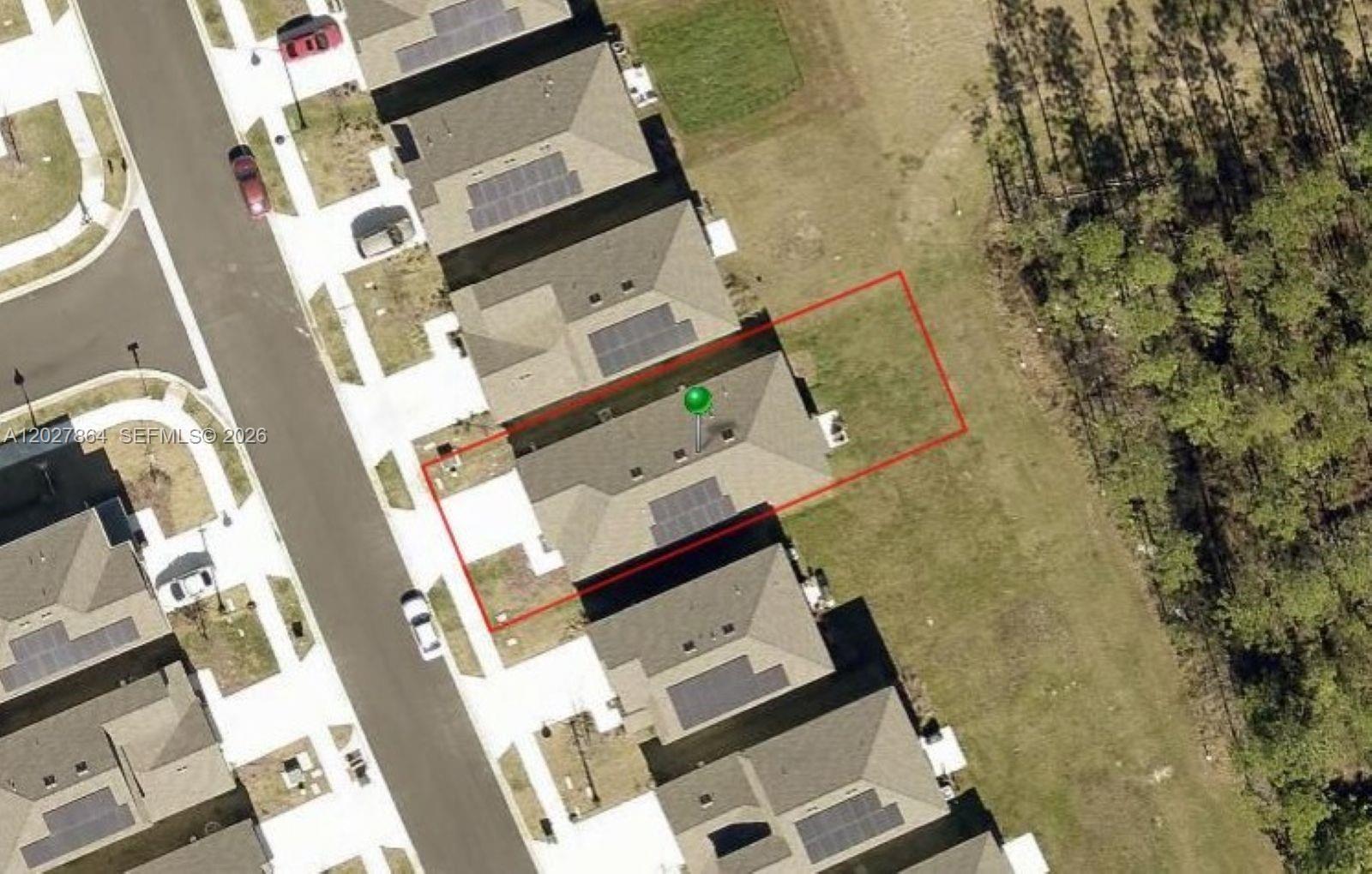 A single-story house exterior features a two-car garage, a covered front porch, and stone accents — 1122 Cabot Cliffs Dr, Daytona FL 32124, DAYTONA, FL