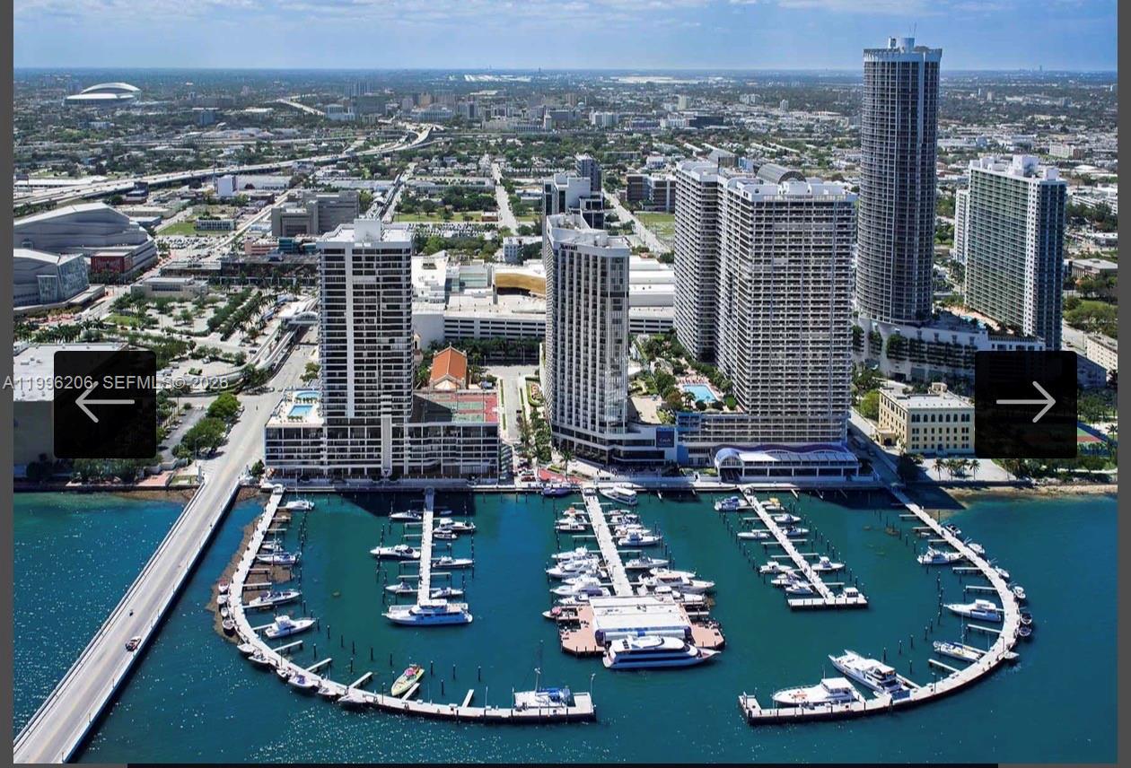 Aerial view of a marina with docked boats in front of high-rise buildings in Miami — 1717 N Bayshore Dr # 2254, Miami FL 33132, MIAMI, FL