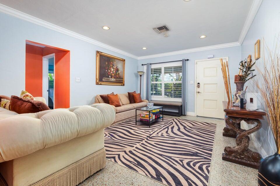 A living room features a zebra-print rug, a beige sofa, and a light-colored front door — 145 SE 3rd Avenue, Boynton Beach FL 33435, BOYNTON BEACH, FL