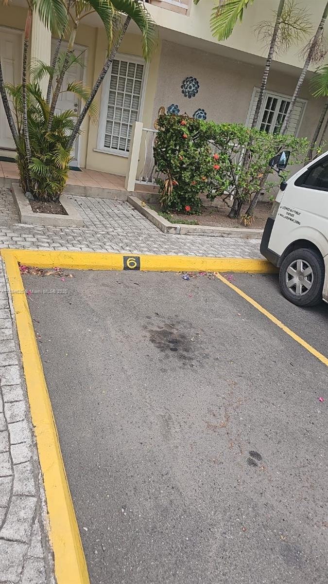 A parking space marked with the number six sits in front of a residential building — 00 Waterloo Rd, Kingston Jamaica # 01, NA, NA