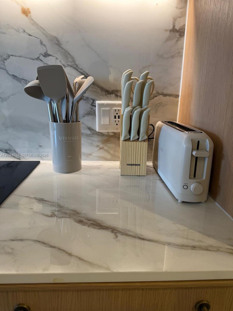 A kitchen counter features a utensil holder, a knife block, and a toaster — 2700 NW 2ND AVE # 209, Miami FL 33127, MIAMI, FL