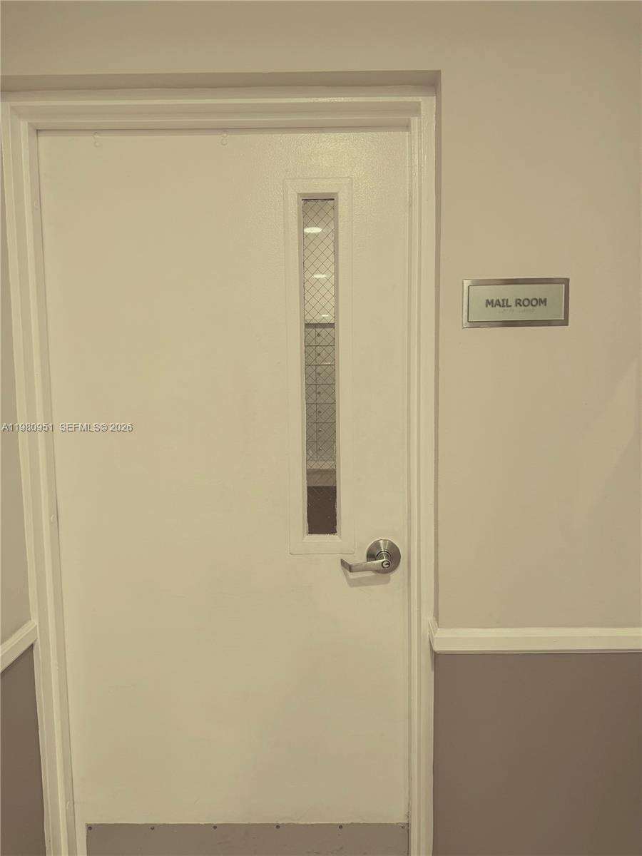 A white door with a vertical window and a mail room sign on the wall — 900 SW 8th St # 604, Miami FL 33130, MIAMI, FL