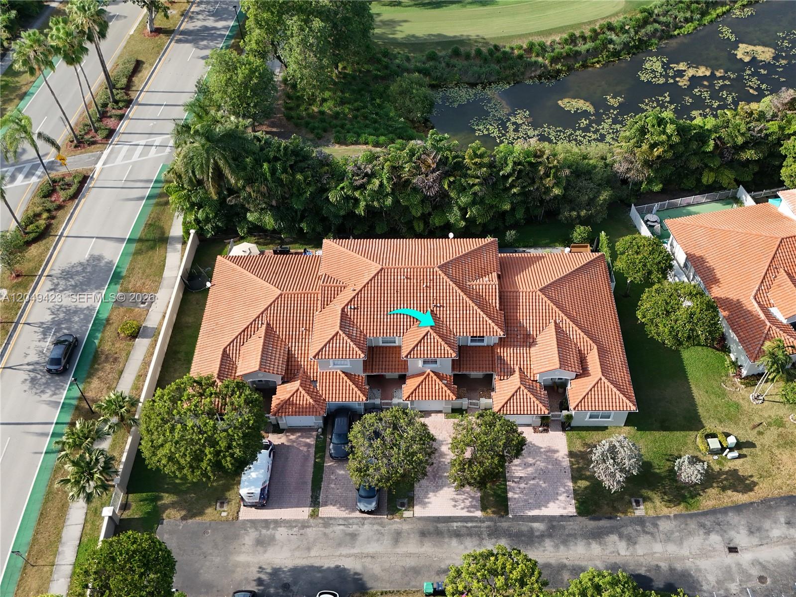 An aerial view shows a multi-unit residential building with a terracotta tile roof — 10183 NW 43rd Ter, Doral FL 33178, DORAL, FL