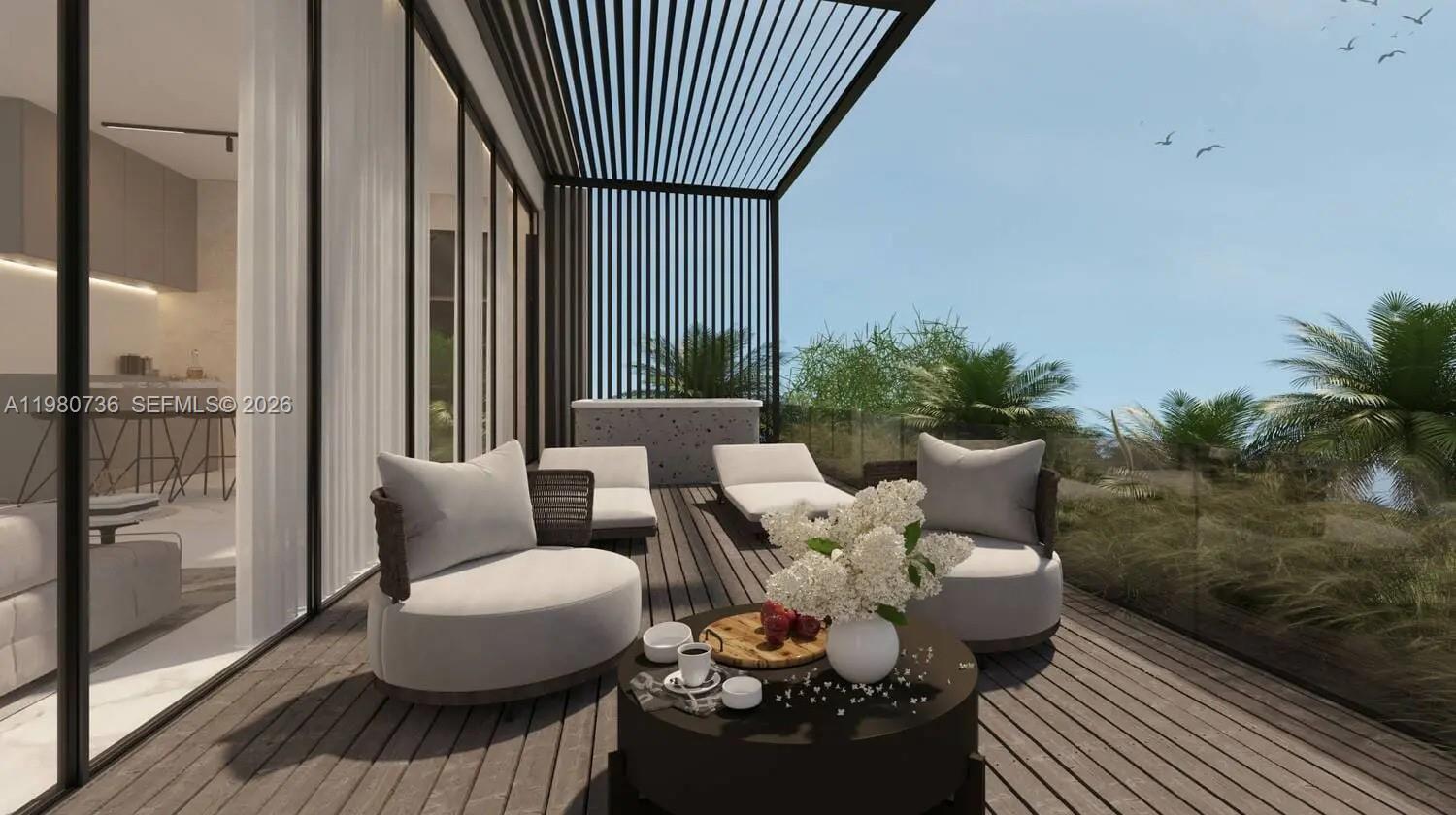 This architectural rendering shows a modern balcony with lounge seating, a coffee table, and pergola — 1st Hillside Street, Dubai, FL