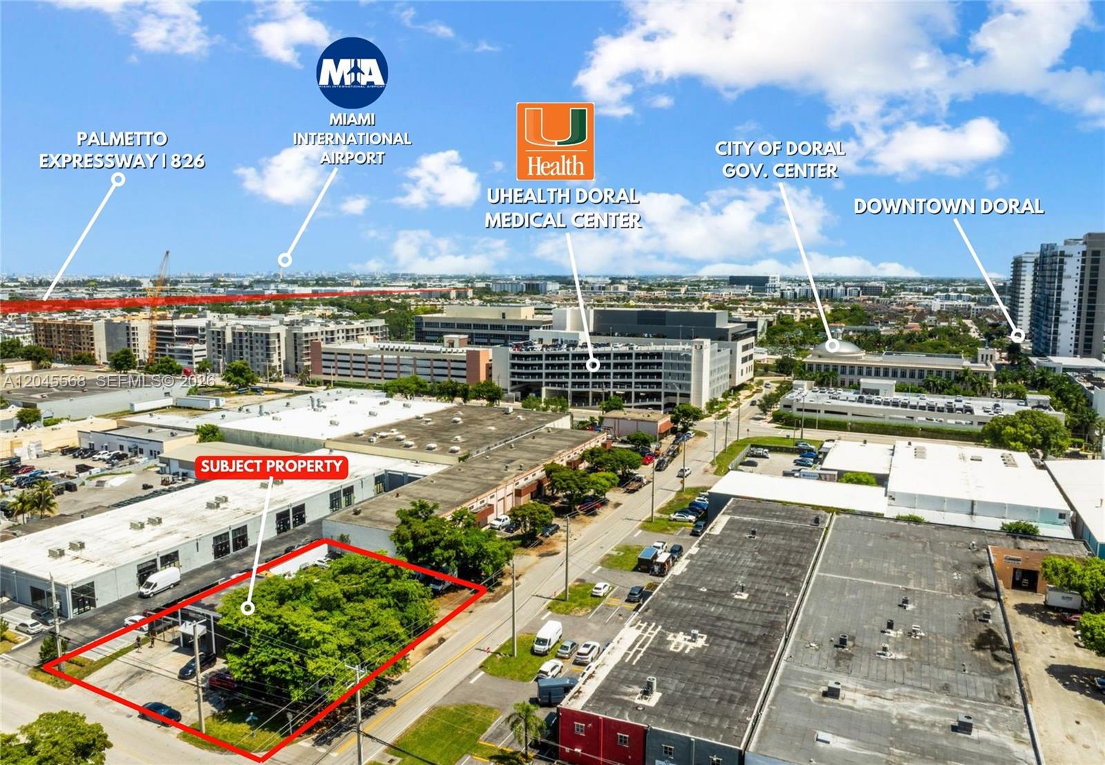 This aerial view shows a vacant, tree-covered lot outlined in red within an urban area — 5571 NW 84th Ave, Doral FL 33166, DORAL, FL