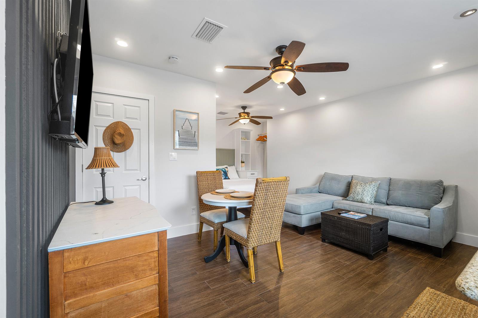 A studio apartment features a dining set, a gray sectional sofa, and a ceiling fan — 43 W Plumosa Lane, FL 33467, FL