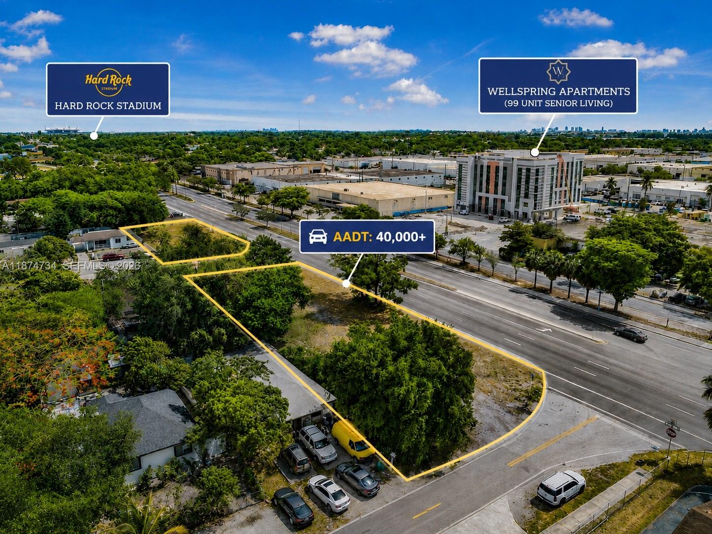 An aerial view shows a vacant lot outlined in yellow next to a busy road — NW 27th, Opa-Locka FL 33054, OPA-LOCKA, FL
