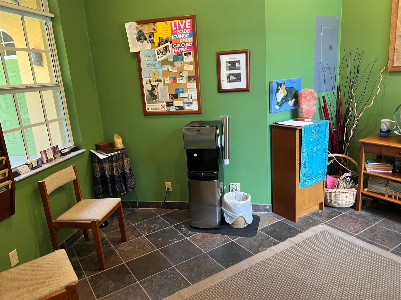 A waiting room with green walls, tile flooring, a water cooler, and wooden chairs — 720 NE 3rd, Fort Lauderdale FL 33304, FORT LAUDERDALE, FL