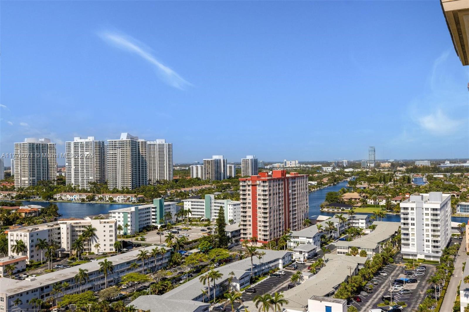 An elevated view of a residential neighborhood featuring high-rise buildings, canals, and parking lots — 2080 S Ocean Dr, Hallandale Beach FL 33009, HALLANDALE BEACH, FL