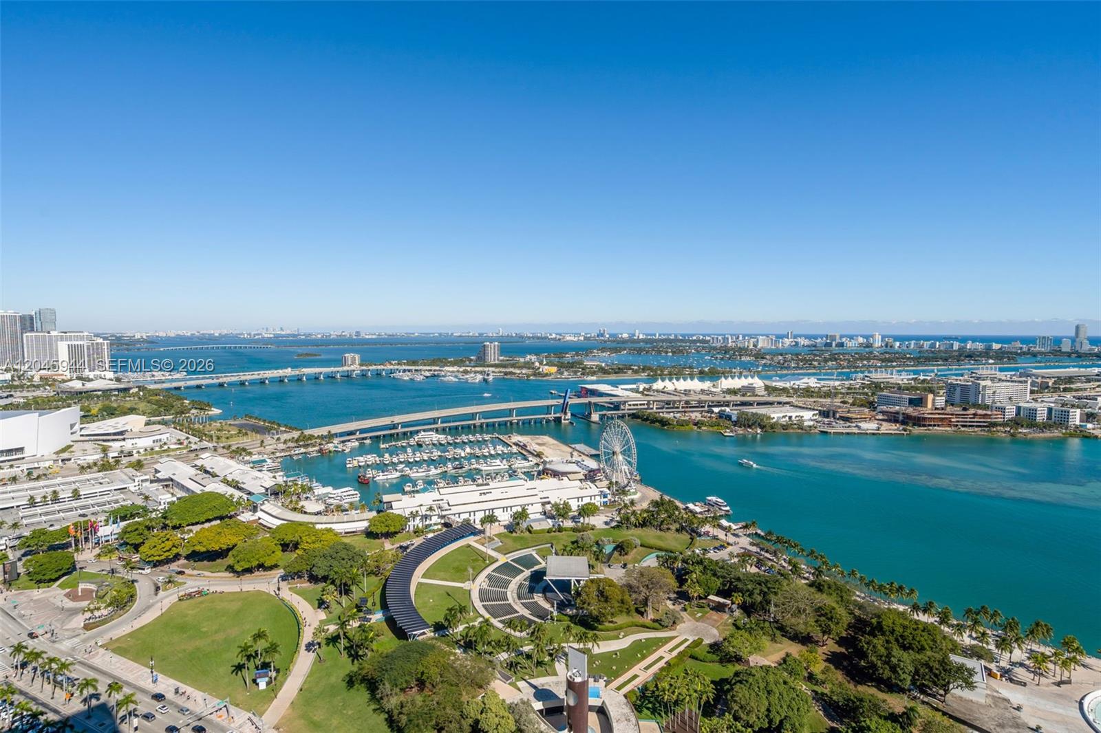 An aerial view of a waterfront park, marina, Ferris wheel, and bridge in Miami — 50 Biscayne Blvd # 4208, Miami FL 33132, MIAMI, FL