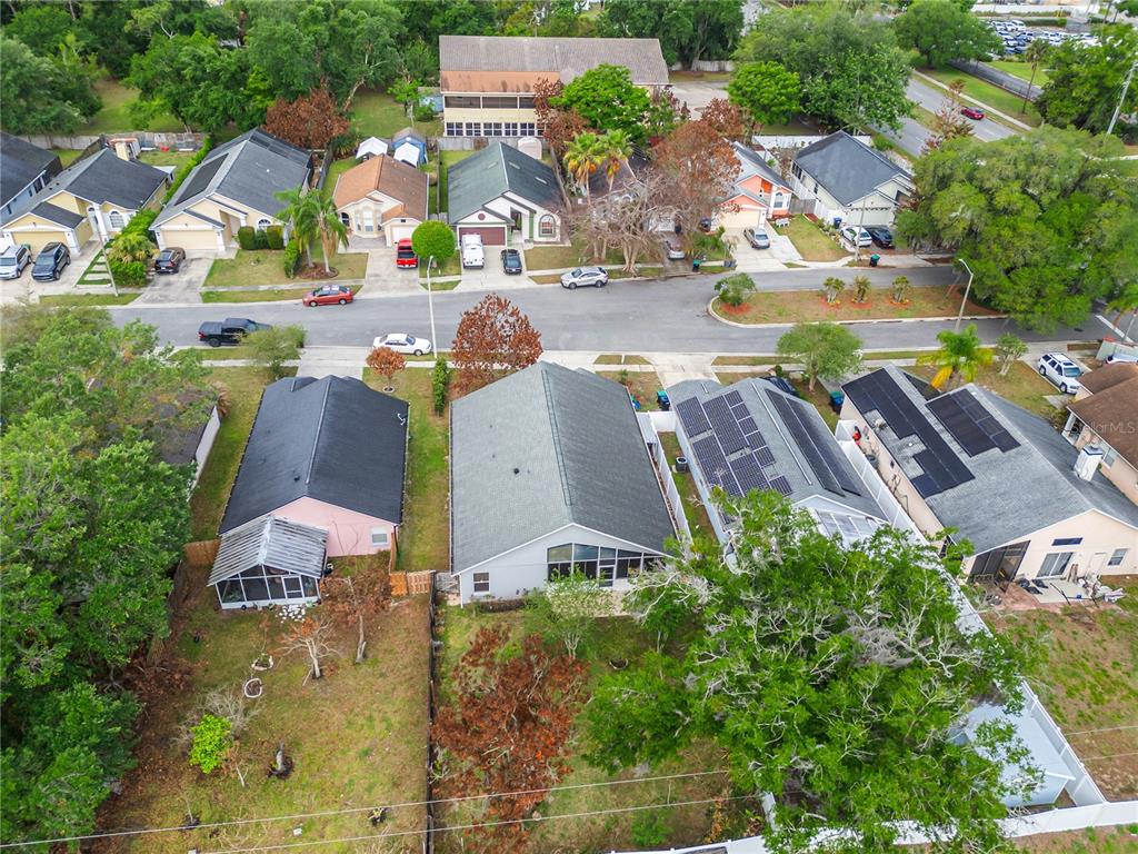 An aerial view shows a residential street with several single-family homes and their backyards — 3013 CATHERINE WHEEL COURT, ORLANDO, FL