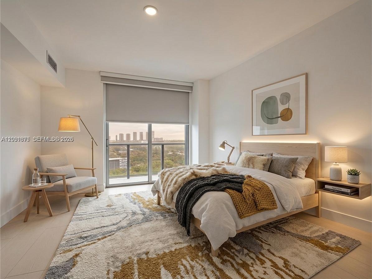 This bedroom features a platform bed, a patterned area rug, and a balcony with views — 16385 Biscayne Blvd # 1615, North Miami Beach FL 33160, NORTH MIAMI BEACH, FL