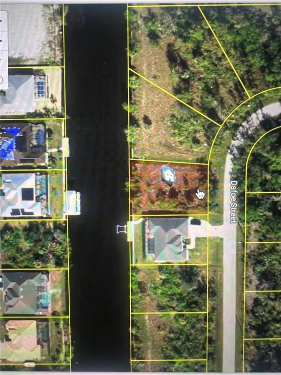 This aerial map shows a vacant residential lot situated between a canal and a street — 8185 DAFOE STREET, PORT CHARLOTTE, FL