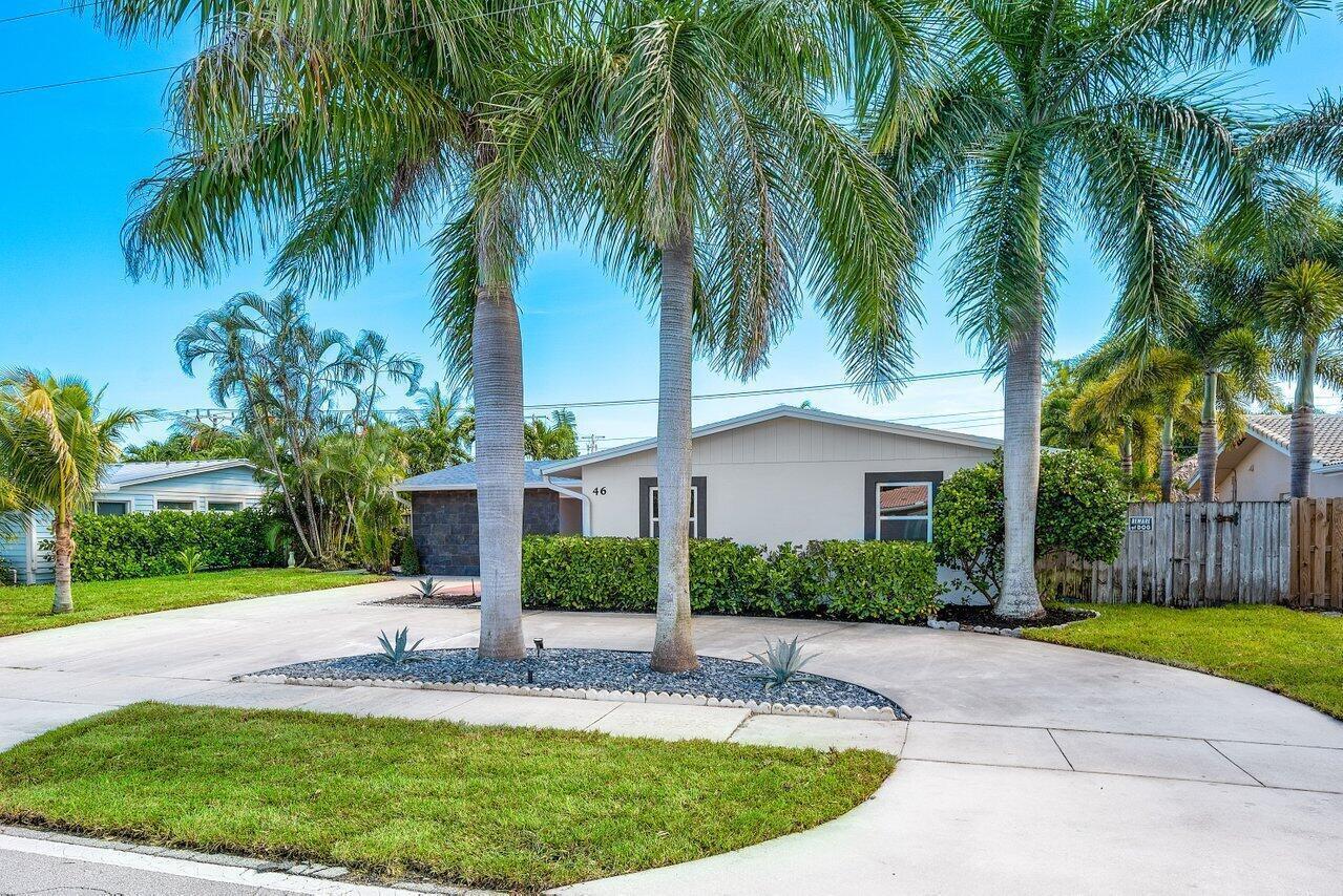 A single-story house with a paved driveway and palm trees in the front yard — 46 SW 9th Avenue, Boca Raton FL 33486, BOCA RATON, FL