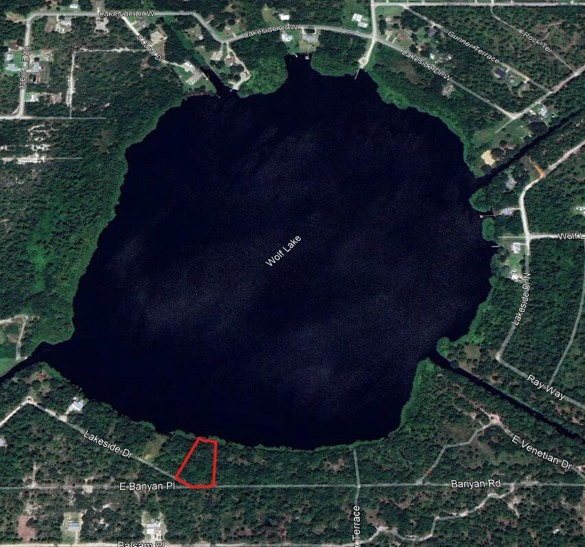 This aerial map shows a vacant lot outlined in red located near Wolf Lake — 6605 E Banyan Place, Sebring FL 33875, SEBRING, FL