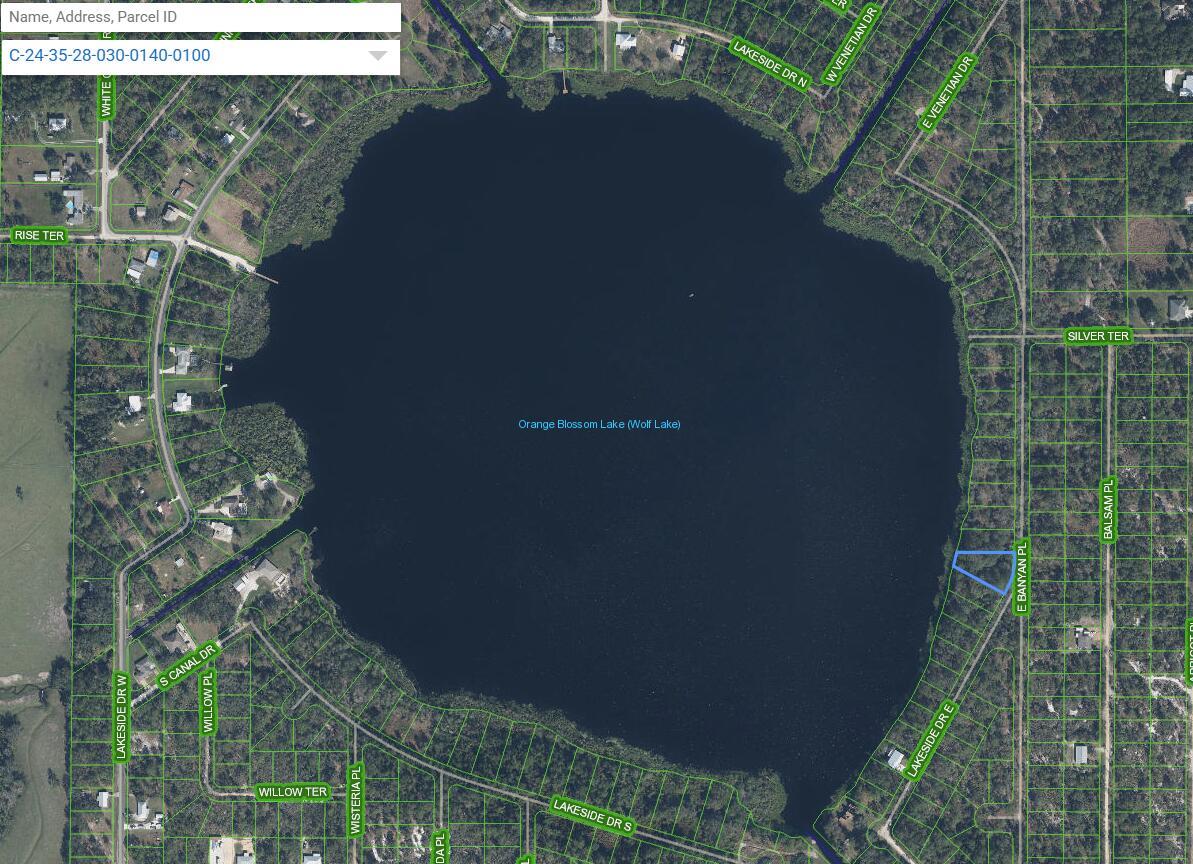 This is a satellite map showing Orange Blossom Lake surrounded by residential properties and streets — 6605 E Banyan Place, Sebring FL 33875, SEBRING, FL