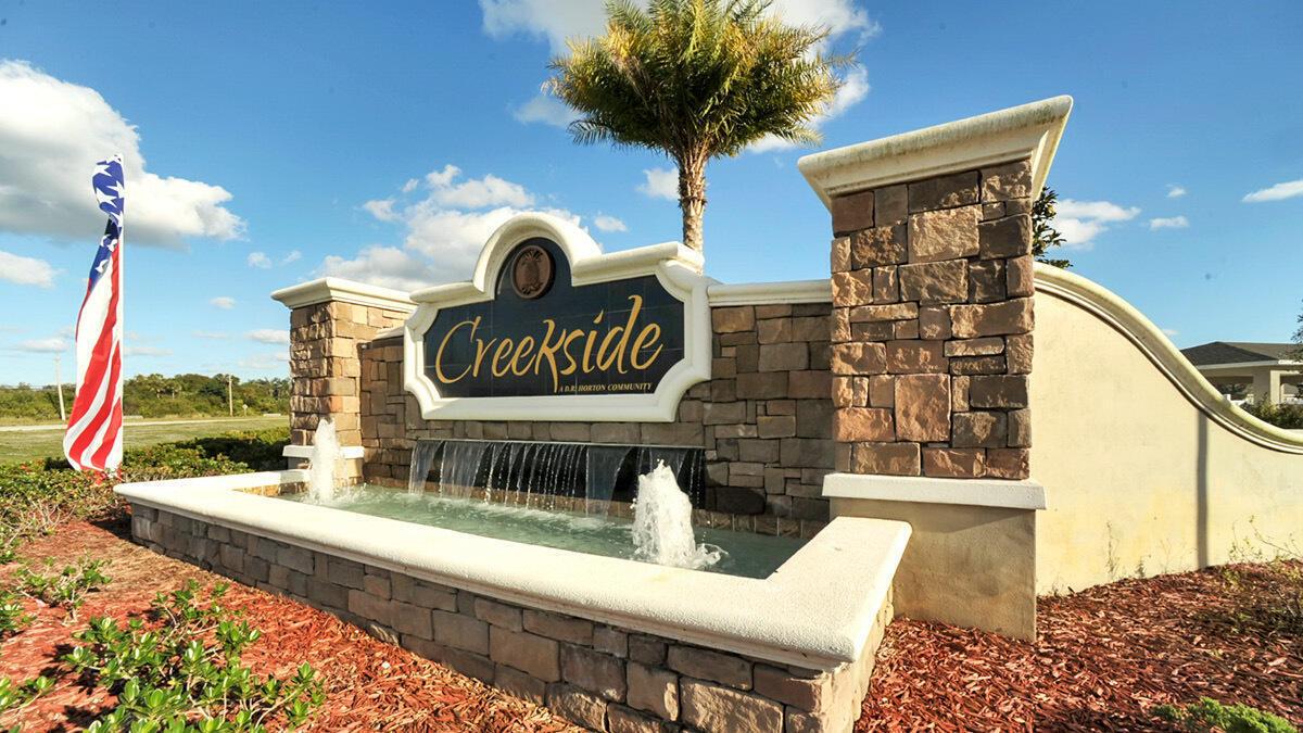 A stone monument sign for a community named Creekside features a water fountain and palm — 9617 Potomac Drive, Fort Pierce FL 34945, FORT PIERCE, FL