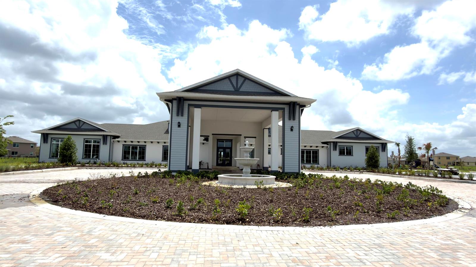 A single-story building with a covered entrance, a central fountain, and a circular driveway — 9617 Potomac Drive, Fort Pierce FL 34945, FORT PIERCE, FL