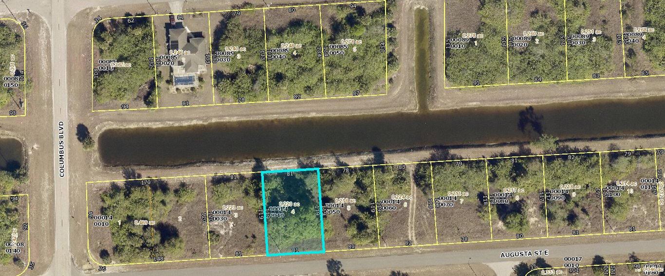 This is a satellite map showing residential lots and a canal in a suburban area — 1207 Augusta Street E, Lehigh Acres FL 33974, LEHIGH ACRES, FL