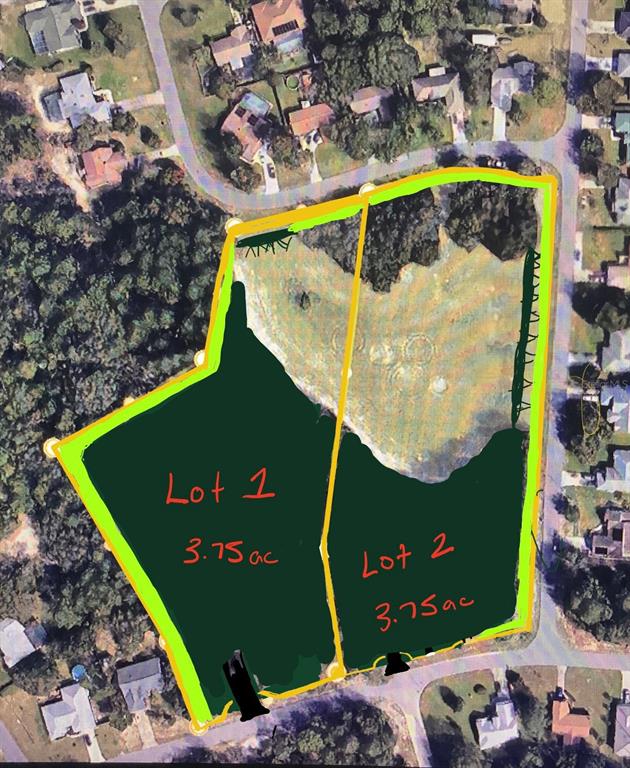 An aerial view shows a wooded, undeveloped corner lot situated between two paved residential streets — 0 FAYSON LANE, SPRING HILL, FL