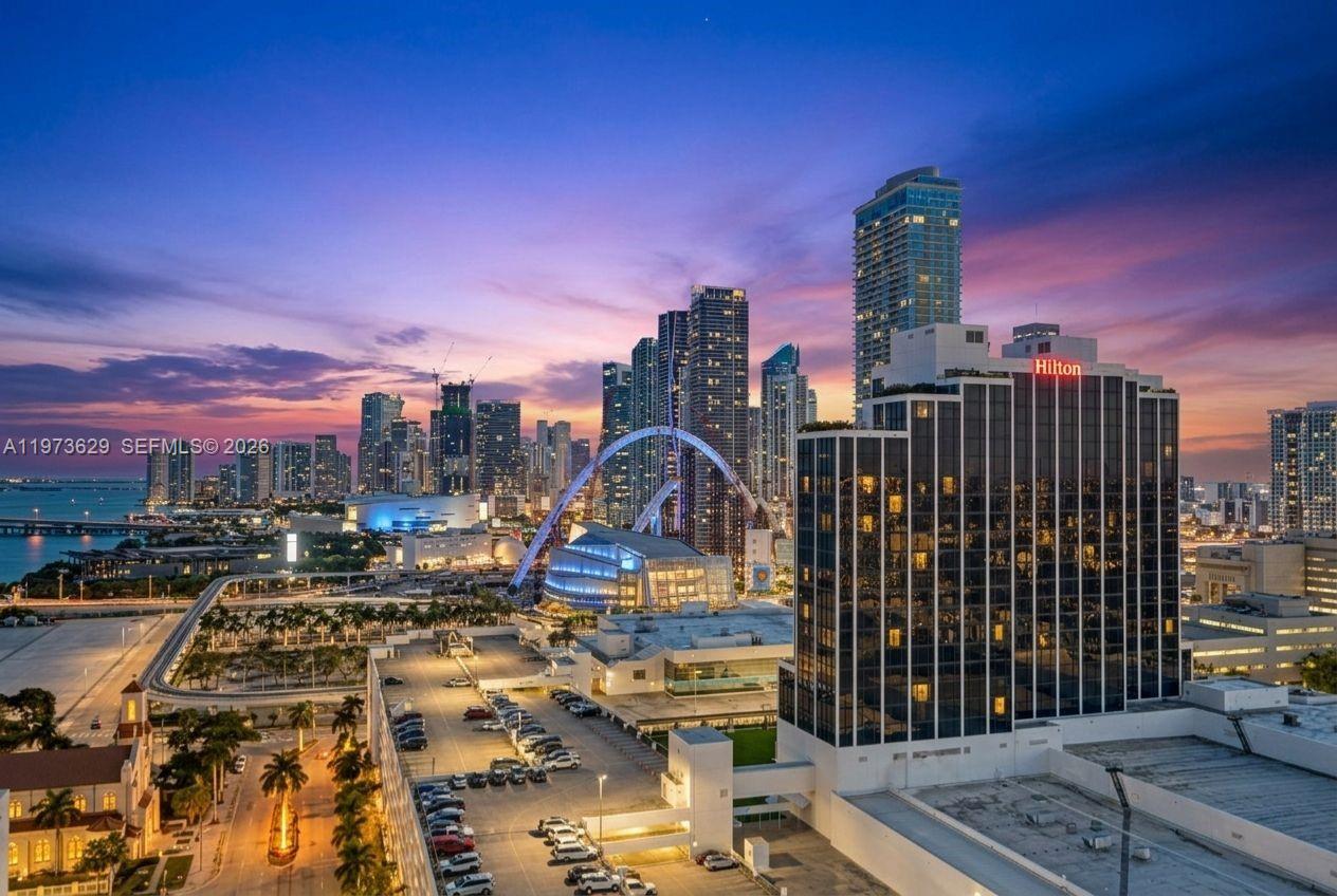 An aerial view of the Miami skyline at sunset featuring the Hilton hotel and bridge — 1750 N Bayshore Dr # 2510, Miami FL 33132, MIAMI, FL