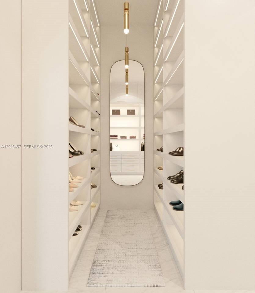This is a rendering of a modern walk-in closet with white shelving and a mirror — 2300 Cap cana, FL