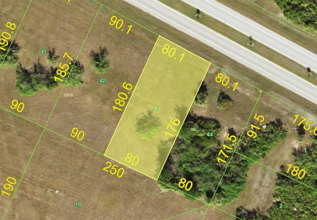 This is a satellite map showing property lot lines and dimensions for a residential plot — 313 INGRAM BOULEVARD, ROTONDA WEST, FL