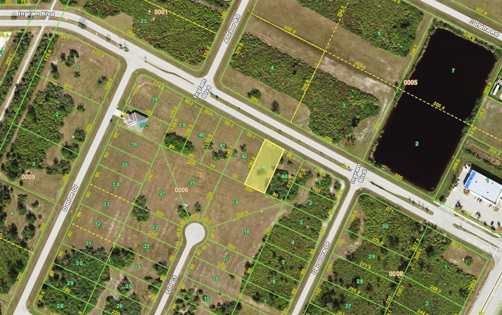 This is an aerial map showing residential lots, streets, and a large pond — 313 INGRAM BOULEVARD, ROTONDA WEST, FL