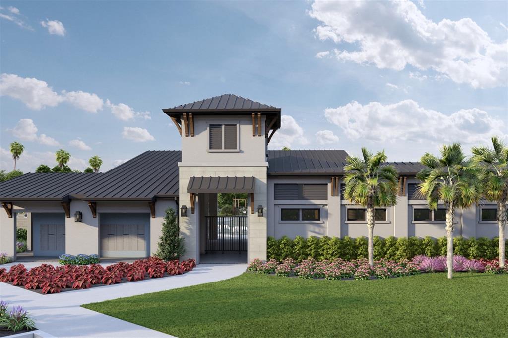 A modern kitchen features white cabinets, a large central island, and stainless steel appliances — 12927 PIERCE STREET, PARRISH, FL