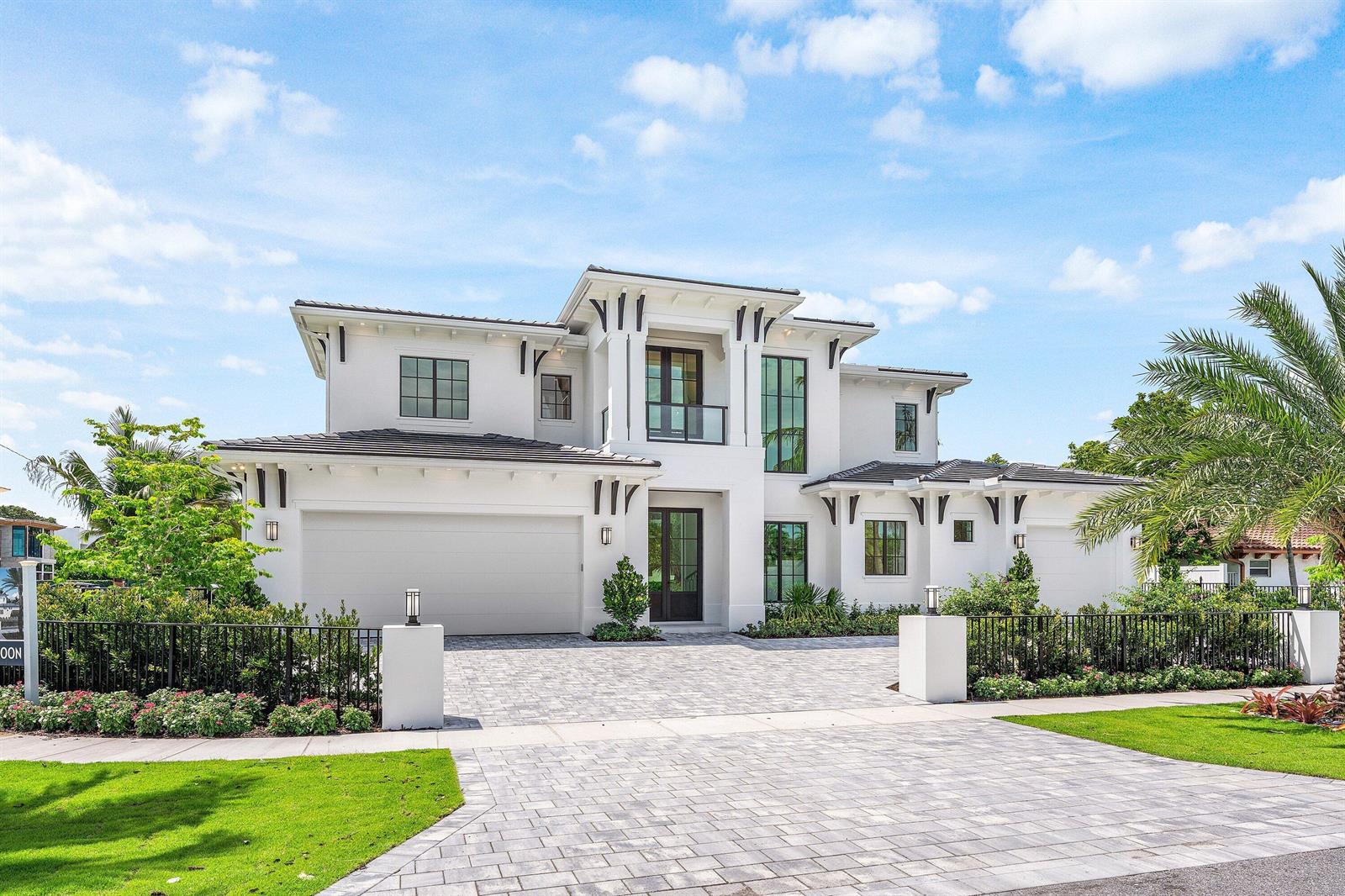 A two-story modern white house with a paved driveway and a black metal fence — 201 NE 4th Avenue, Boca Raton FL 33432, BOCA RATON, FL