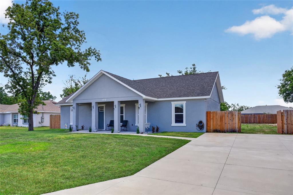 A gray single-story house with a covered front porch and a concrete driveway — 9449 SE 158TH PLACE, SUMMERFIELD, FL