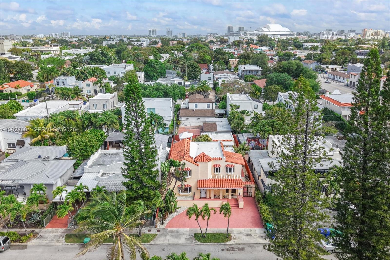 An aerial view shows a two-story Mediterranean-style house with a red tile roof — 1727 SW 11th Ter, Miami FL 33135, MIAMI, FL