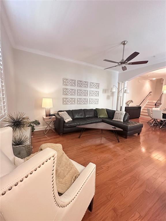 A three-story light green townhouse with a balcony and an adjacent round tower structure — 2303 KENSINGTON GARDEN LANE, TAMPA, FL