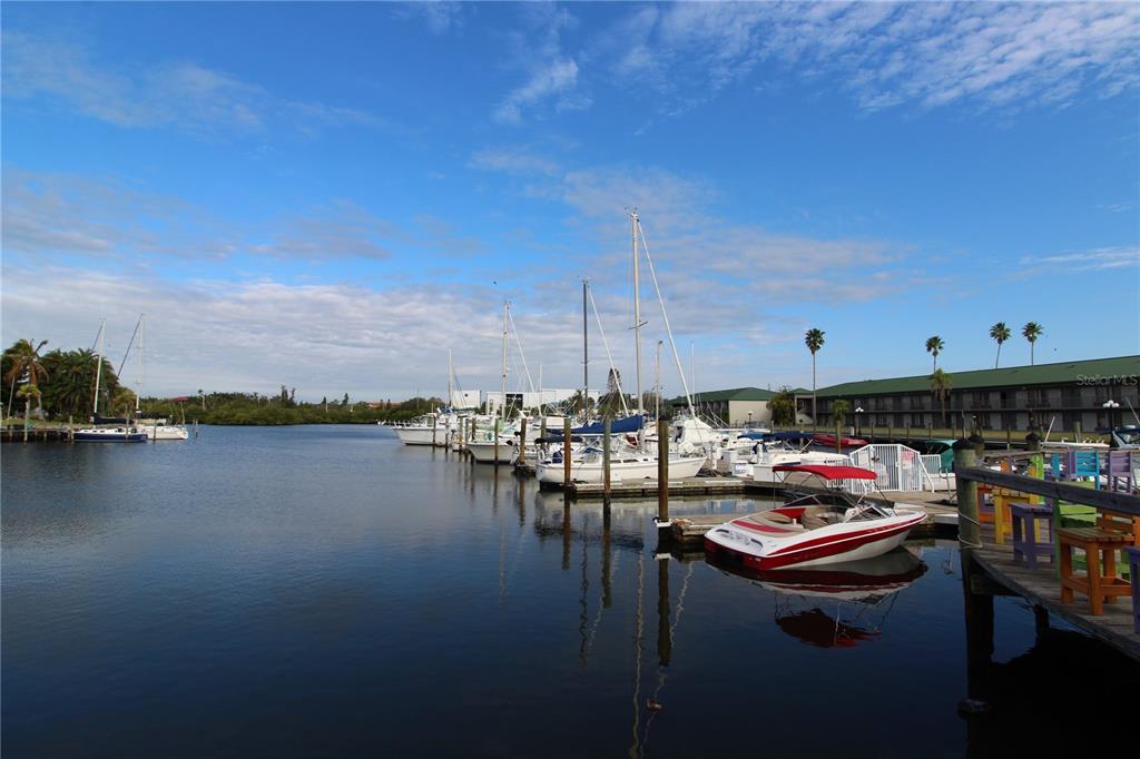 A lounge area features wood-look flooring, red beanbag chairs, a television, and a snack vending machine — 7150 N TAMIAMI TRAIL UNIT C226, SARASOTA, FL