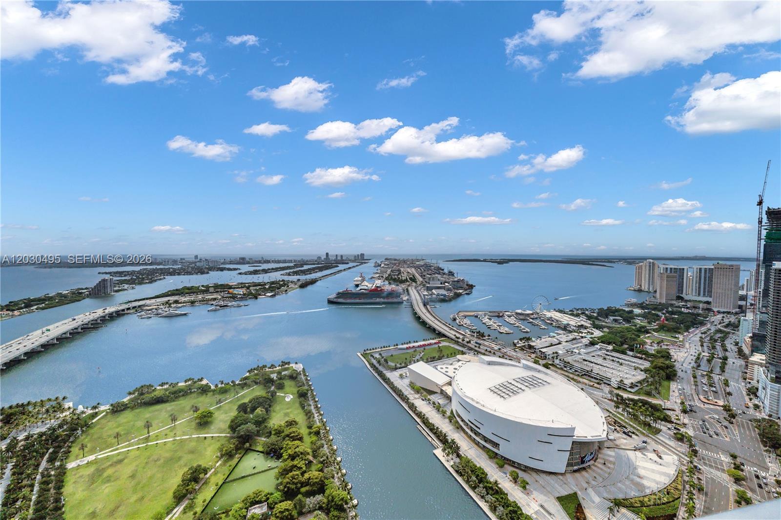An aerial view shows a waterfront arena, a cruise ship, and a bridge in Miami — 900 Biscayne Blvd, Miami FL 33132, MIAMI, FL