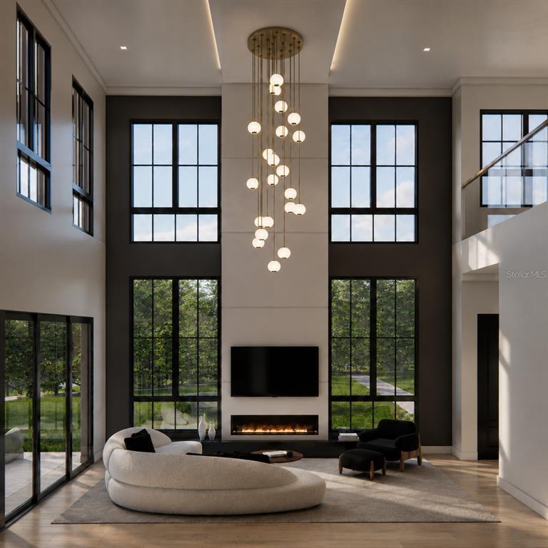 This rendering shows a modern living room with a tall fireplace, chandelier, and large windows — 826 GARDEN PLAZA, ORLANDO, FL