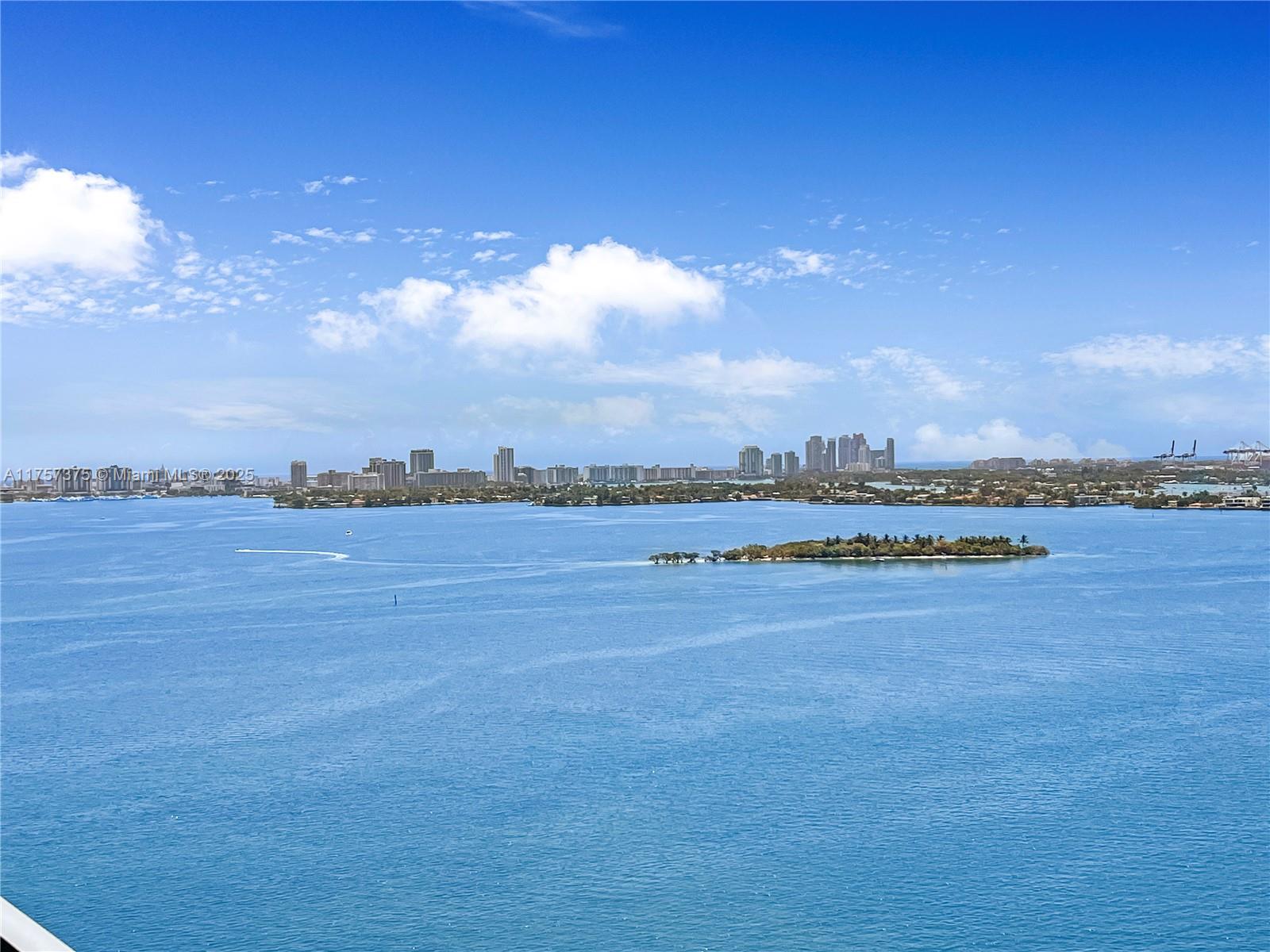 A high-angle view of a blue bay with a small island and distant city skyline — 2900 NE 7th Ave # 2008, Miami FL 33137, MIAMI, FL